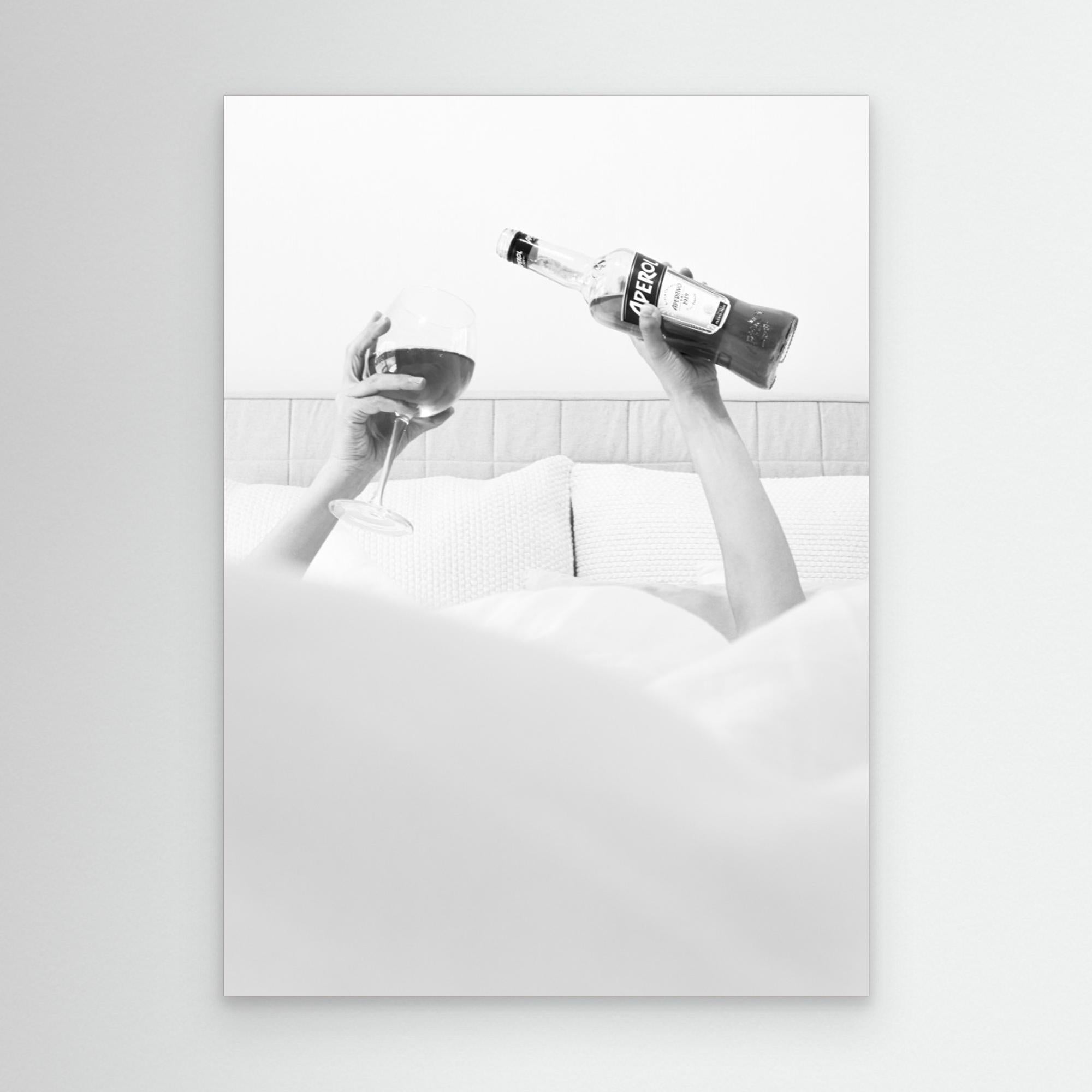 Black and white artwork of a person holding a bottle and a bowl on a white background