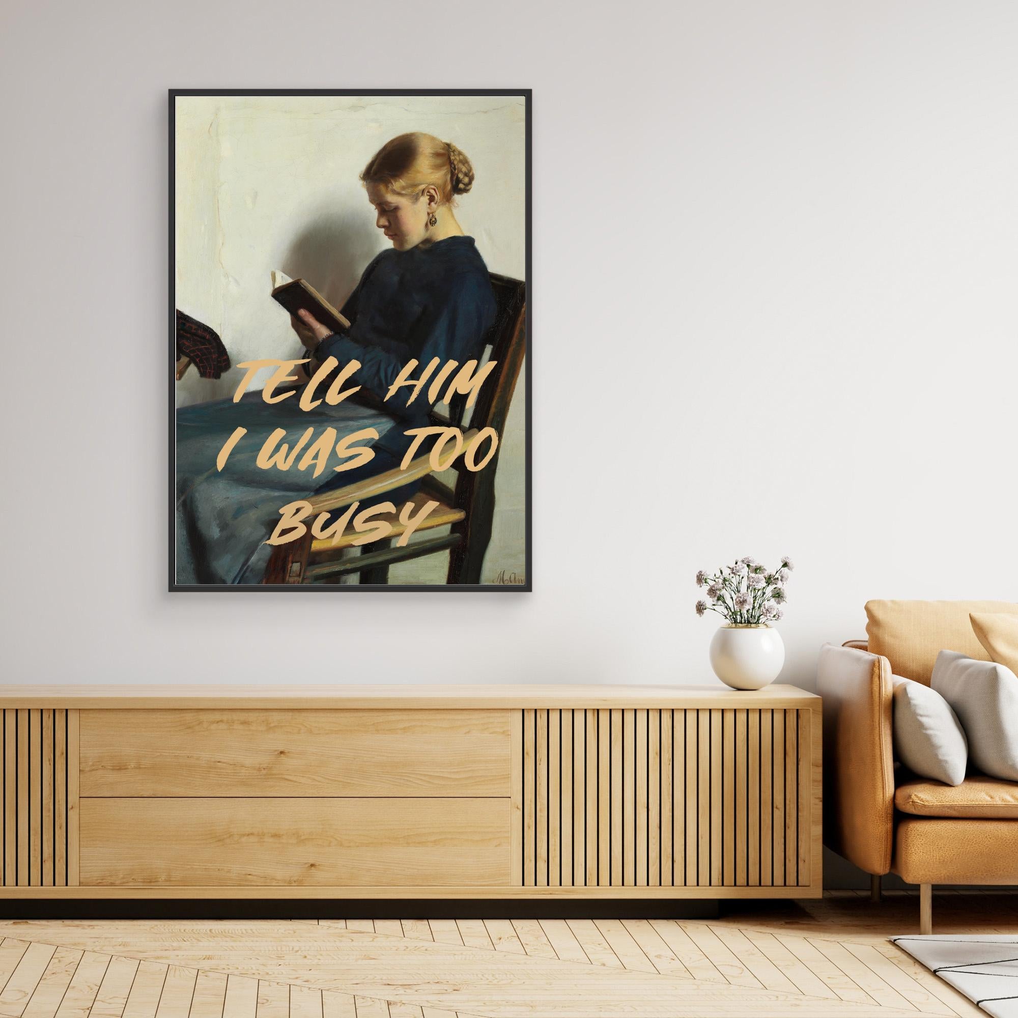Framed artwork with text in a modern living room setting