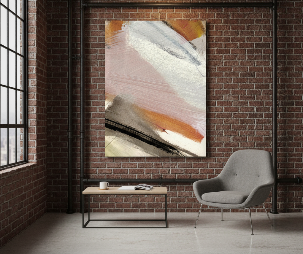 Abstract painting on a brick wall above a grey chair and small table.