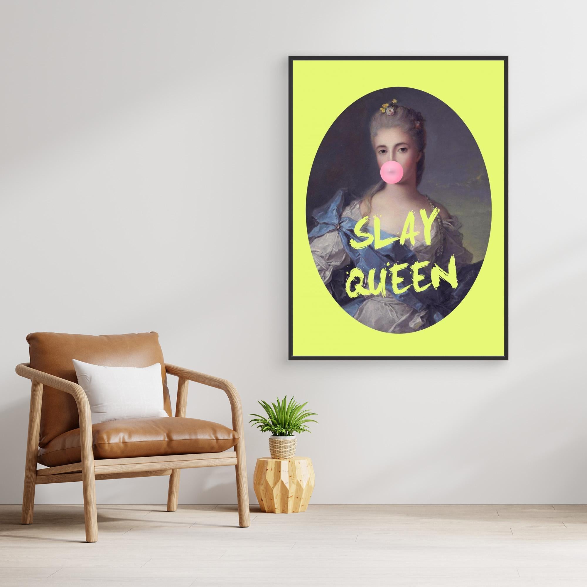 Framed artwork with 'SLAY QUEEN' text on a yellow background, placed above a brown armchair.